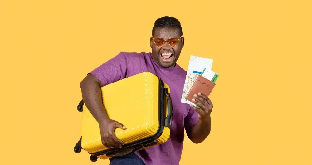Black Man With Suitcase Showing Tickets Wearing Sunglasses